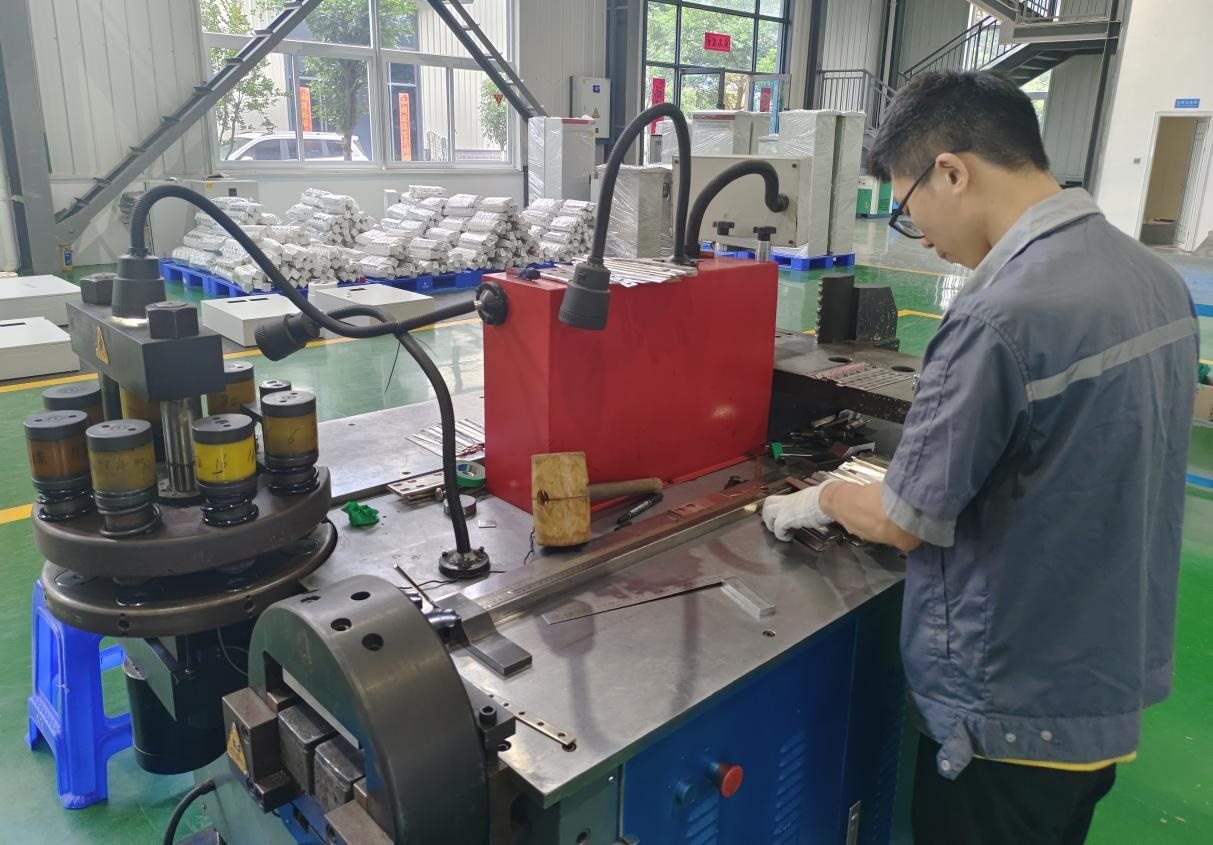 Copper busbar processing in switchgear workshop